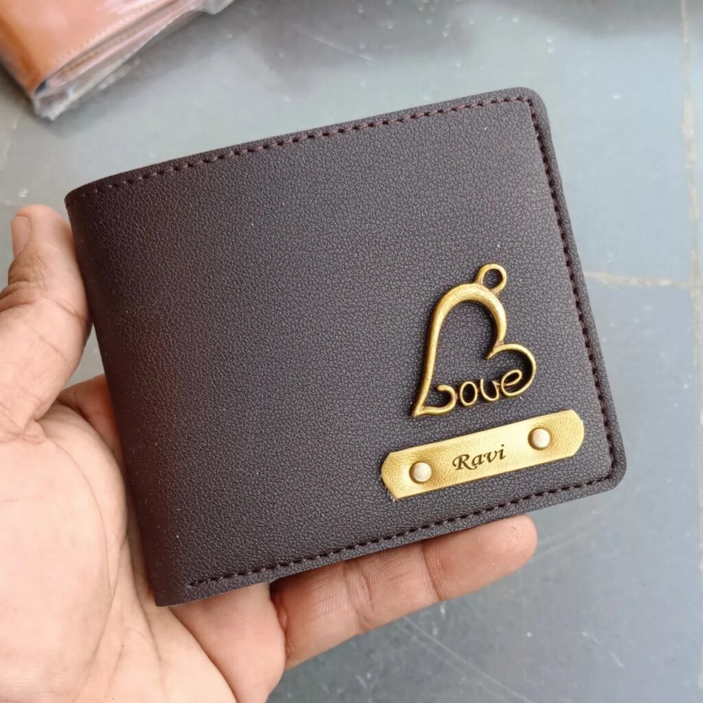 Brown leather wallet with a gold heart charm and personalized name plate Ravi.