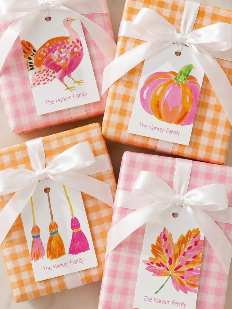 Four gingham wrapped gifts with personalized tags featuring autumn illustrations and family name.